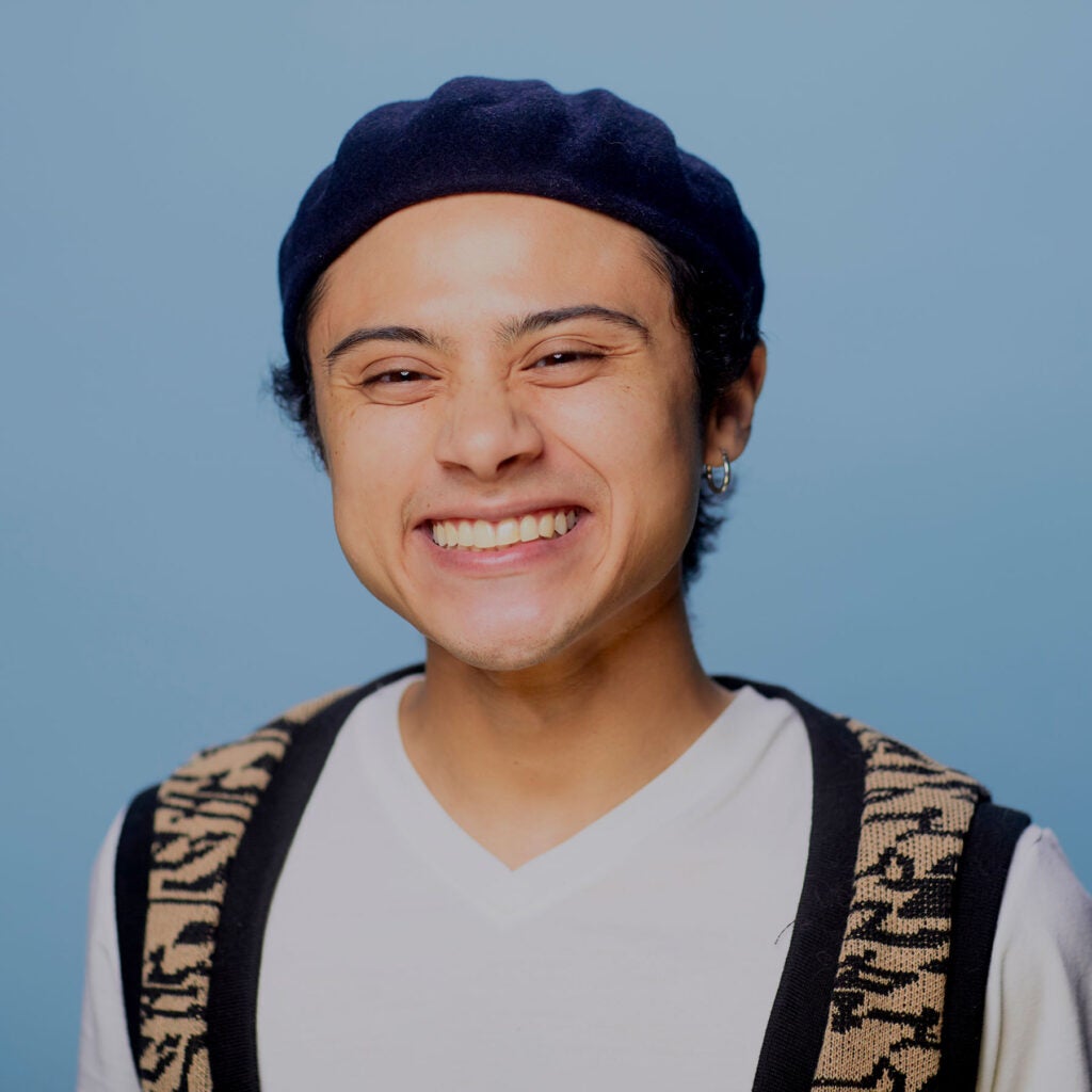 Photo of youth community member on blue background