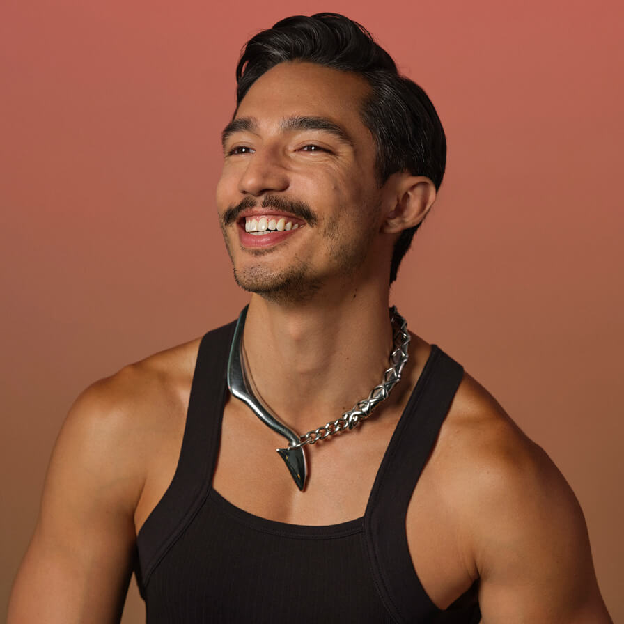 Latinx gay man smiling