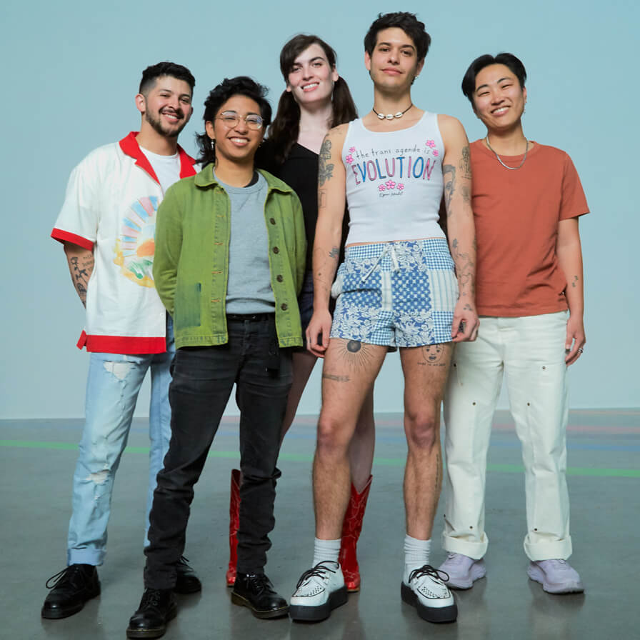 Group of queer youth standing together and smiling